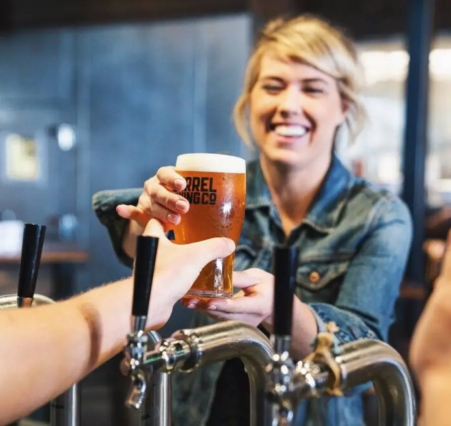 Draft beer being poured through an amusement park beverage system for fast guest service